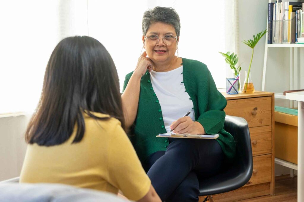 Man meets with his therapist about his mental health conditions